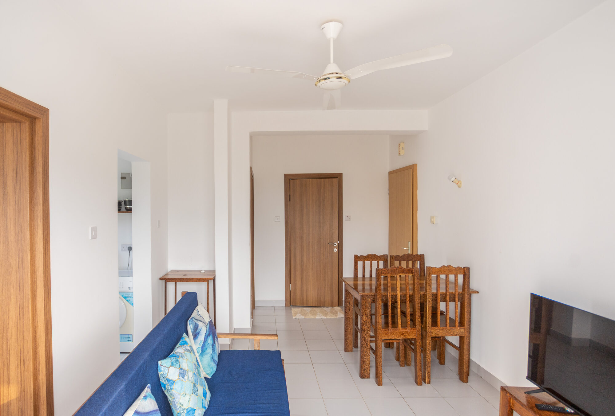 Open plan living area leading to the kitchen