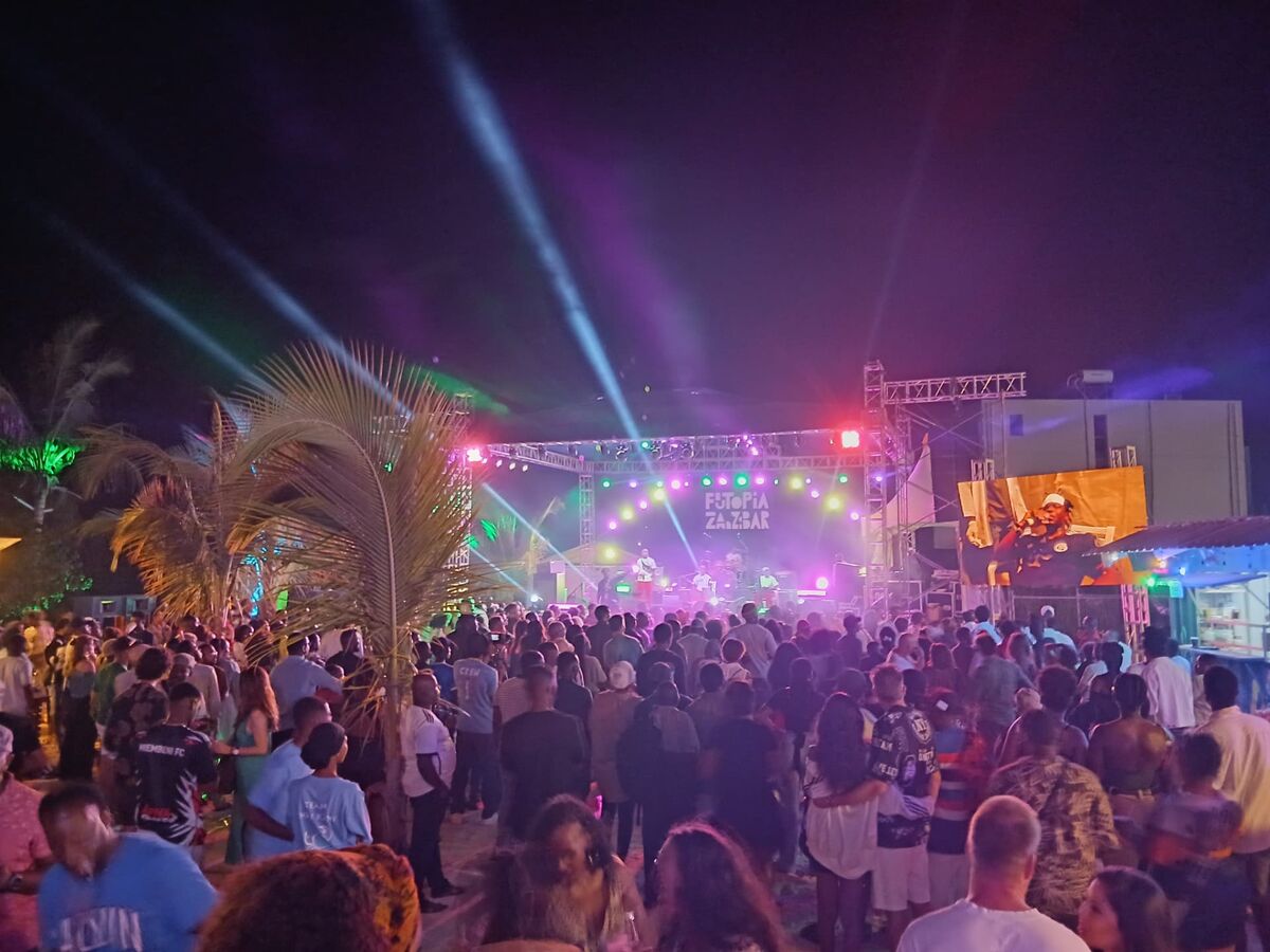 Futopia Zanzibar night festival stage with lights and crowd in Fumba Town