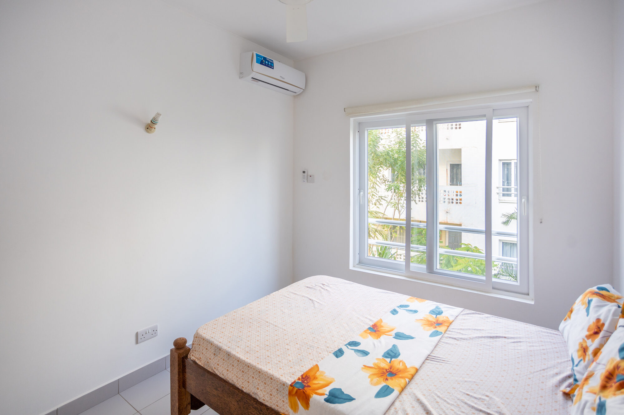 Bedroom with natural light and coastal breeze