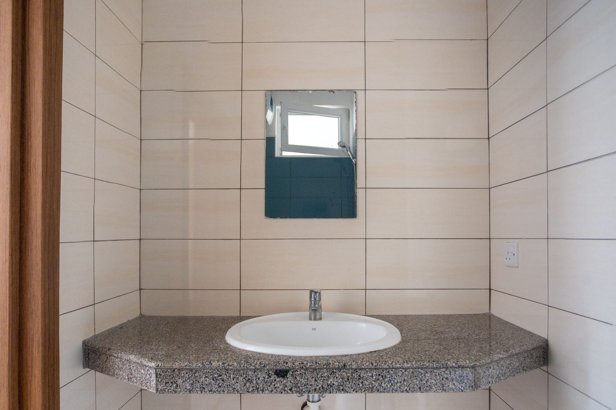 Bathroom with walk-in shower and washbasin